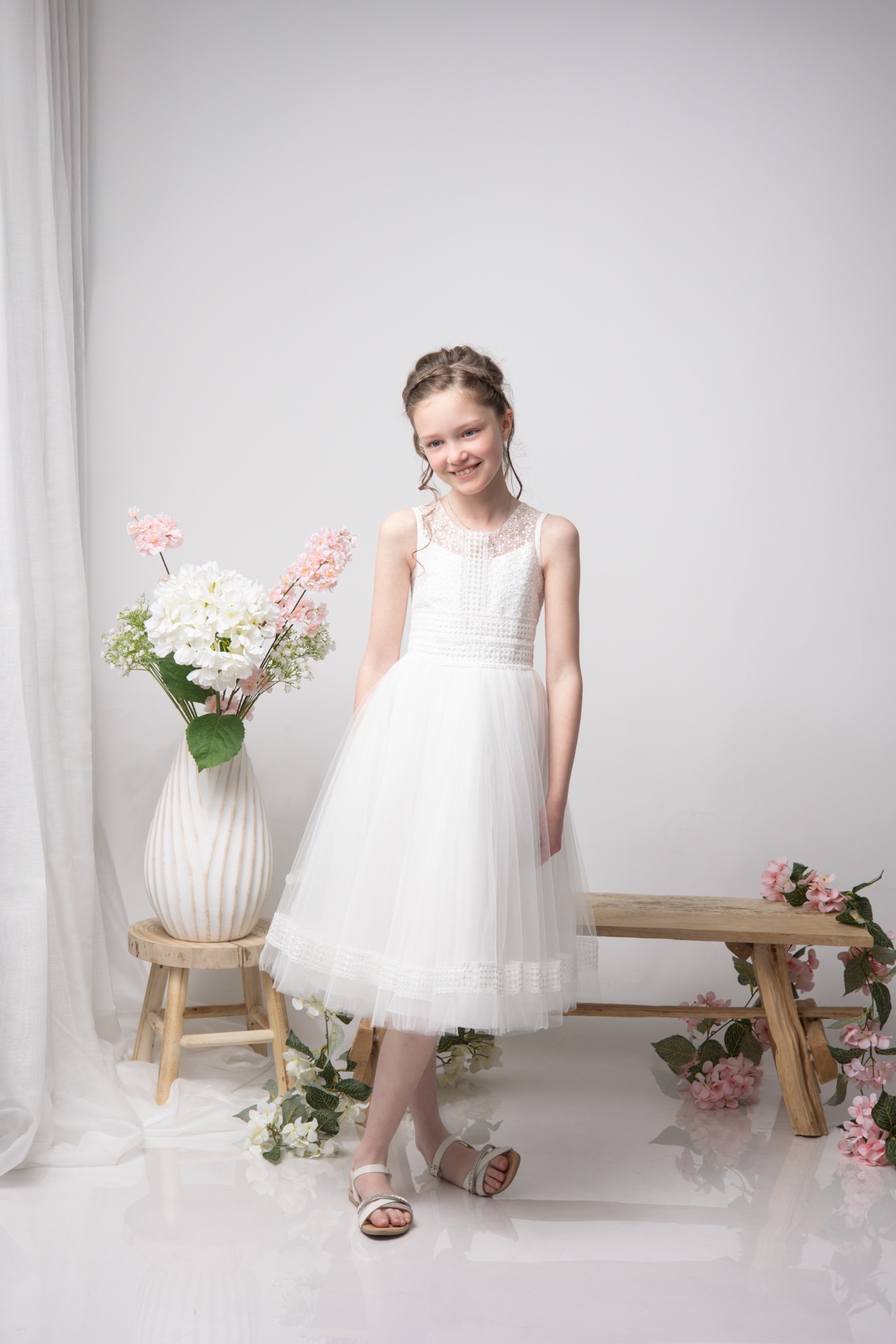 photo d'une fillette en studio pour sa communion
