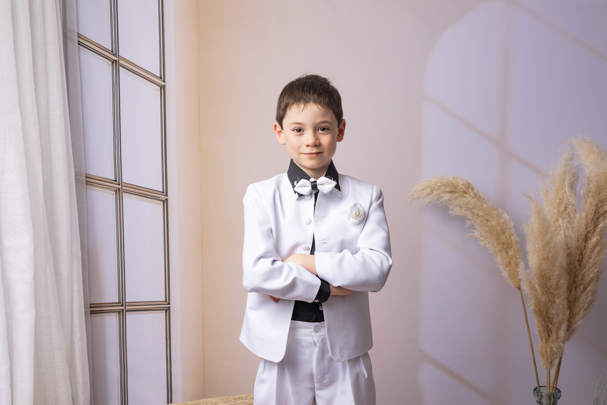 photo d'un garçon en studio pour sa communion